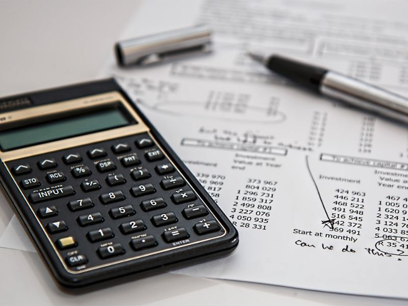 A calculator, pen and spreadsheet