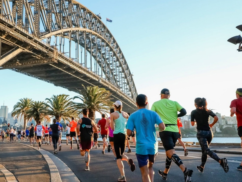 Half-marathon runners underneath the Sydney Harbour Bridge