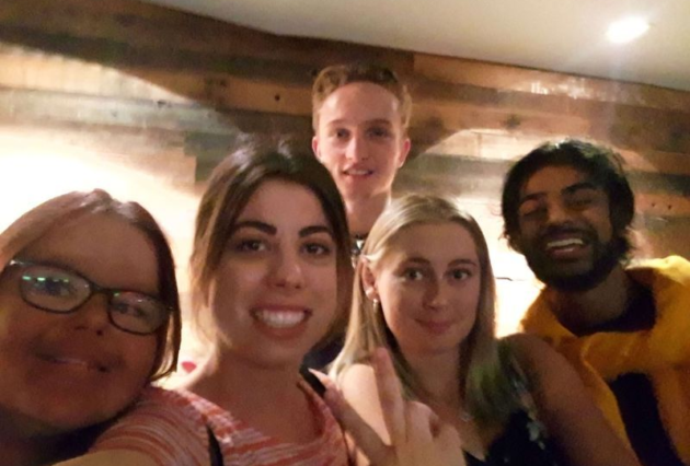 The Youth Champs Group take a selfie in an escape room