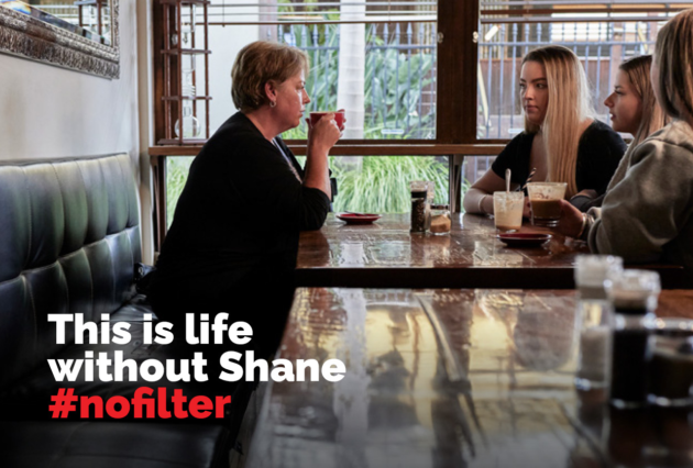 A mother and two daughters at a cafe with text overlay: This is life without Shane #nofilter