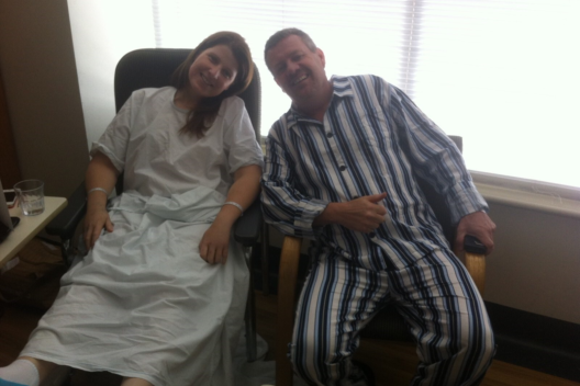 Marina sitting with her living donor post second transplant