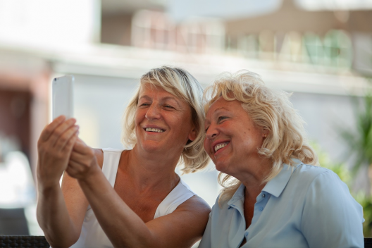 Two women pose for a selfie